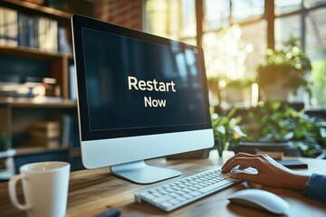 Woman restarting computer at desk in home office