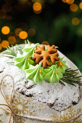 A close-up of a wrapped decorated Christmas Stollen