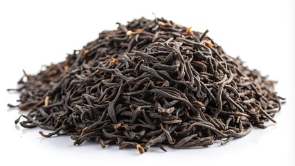 Dried black Earl Grey tea leaves over white background with shallow depth of field