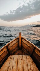 Obraz premium Serene sunset voyage on wooden boat