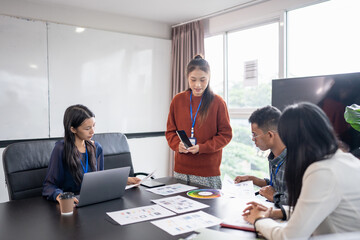 Asian business woman Application Designers presenting trending products report mobile application planning process development software design project ux Graphic designer