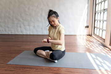 Woman workout with health app on smart watch Close-up hands