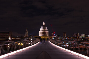 London, UK  - St. Paul's Cathedral and Millennium Bridge at night	