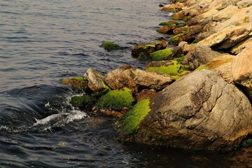 Calm waves on a rocky beach. Waves Crashing On Rocky Beach. Relaxing Ocean. Nature