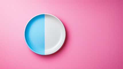 Half Blue and White Plate on Pink Background