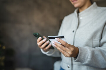 Adult woman use smart phone for online shopping transaction safely