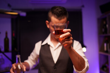 Barman pouring whiskey whiskey glass beautiful night