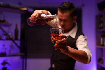 Barman pouring whiskey whiskey glass beautiful night