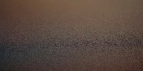 A close up of a brown surface with a few small lines