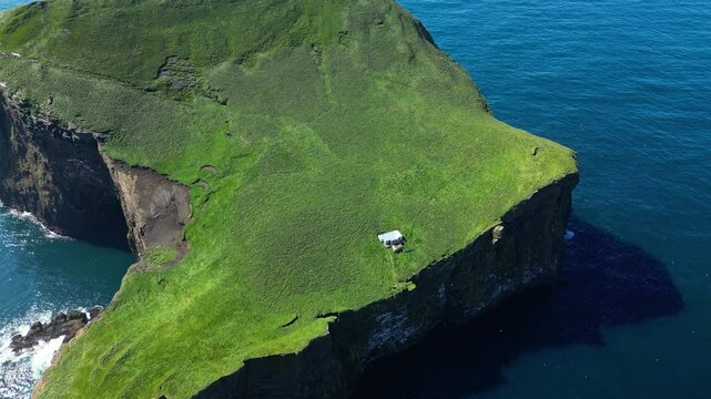 Aerial view of the loneliest house in the world, Vestmannaeyjar iconic landmark, south Iceland