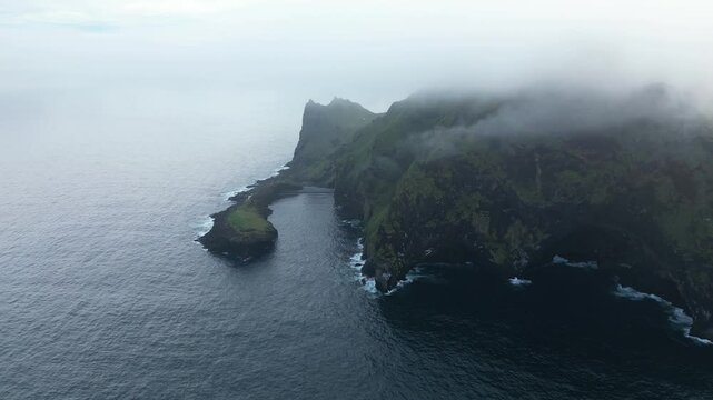 Aerial view of Misty scenery in south of Iceland, dense fog over Elephant rock famous landmark