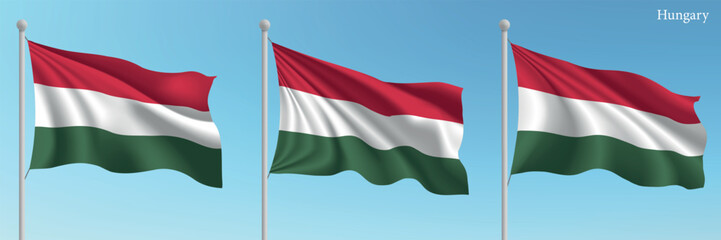 Obraz premium Set of Three Flags of Hungary Waving in Clear Blue Sky