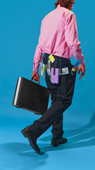 Man walking away with briefcase, his belt filled with tools, pens, sticky notes, and cash against...