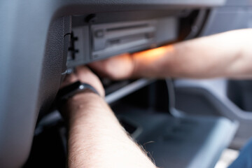 Car air conditioner. Close-up of men's hands and air conditioner. Changing the air filter in the car.