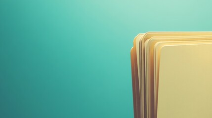 A stack of yellow file folders against a turquoise background.