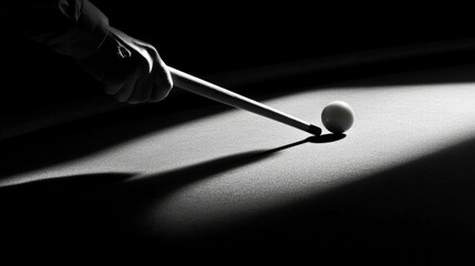 Fototapeta premium Player shadow with a cue, making a precise shot at the billiard ball.