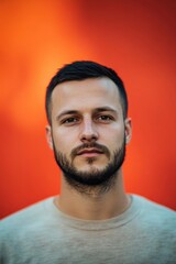Obraz premium Portrait of a caucasian man 25 years old with a short beard and short black hair