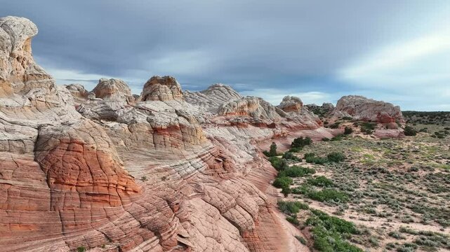 Hiker on Stunning Layered Rock Formations at White Pocket Desert