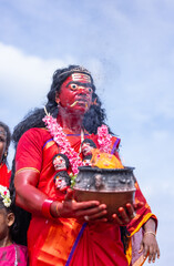 Kulasai Dasara, Portrait of indian woman with painted face and dressed as hindu god kali to perform...