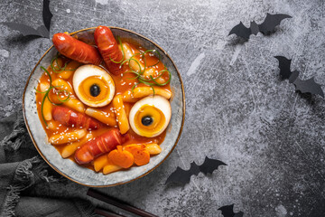 original traditional korean food tteokbokki with red sauce for halloween