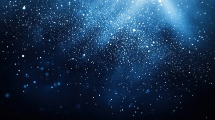 Fototapeta premium A dramatic background featuring deep gradient blends of dark blue to black, reminiscent of a starry night sky. 
