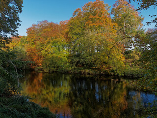 The River North Esk at Edzell slowly meandering down through the Valley with the leaves of the trees turning seasonally golden.