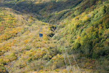 Kurobedaira Station, Tateyama, Toyama, Chubu, Japan, A serene landscape a cable car traversing a...