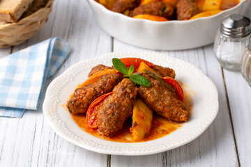 Traditional Homemade Turkish Food Kofte - Kofta with Tomato Sauce and Potatoes. (Turkish name; Izmir kofte)