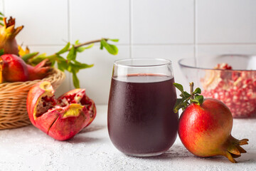 Pomegranate juice with fresh pomegranate fruits