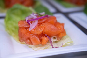 Smoked salmon: Delicious smoked salmon appetizer on lettuce and onion. A classic and elegant breakfast option.