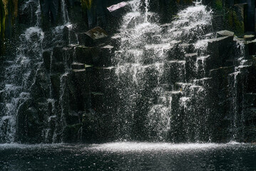 Beautiful Rochester Falls in Mauritius, Africa, showcasing cascading waters over rugged volcanic rock formations, surrounded by lush tropical greenery