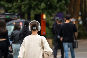 Pedestrians stroll through the city
