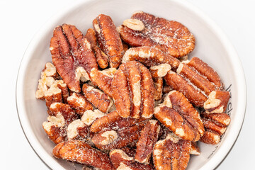 Pecan nuts in air on white background