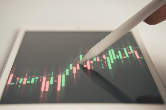 Business using mobile phont with financial graph for business investment growth. Financial, data analysis, goal,success and money concept.