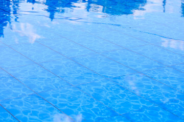 The water is calm and clear, reflecting the sky above