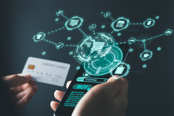 Businessman using mobile phone and credit card with cart and shopping icons for shopping online and e-commerce concept.