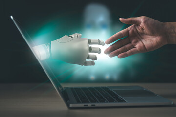 Businessman check hand with AI robot hand for Futuristic technology and artificial intelligence concept.