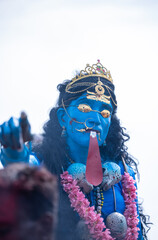 Kulasai Dasara, Portrait of indian woman with painted face and dressed as hindu god kali to perform...