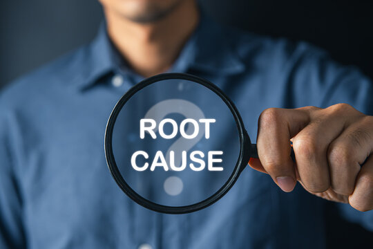 Businessman using magnifier find out the root cause problems. root cause and solution concept.
