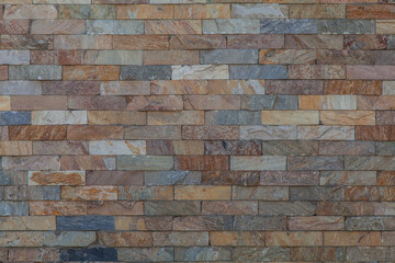 Texture of a wet rusty stone. Decorative brick wall , background