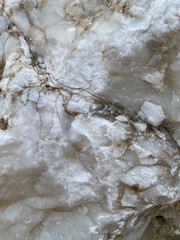 Natural rock texture. Mountain rough surface. Close-up. Stone wall background with copy space for design. Vertical banner
