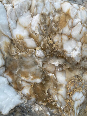 Natural rock texture. Mountain rough surface. Close-up. Stone wall background with copy space for design. Vertical banner.