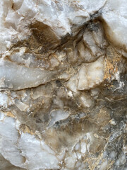 Natural rock texture. Mountain rough surface. Close-up. Stone wall background with copy space for design. Vertical banner 