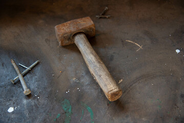 Old rusty hammer on simple background.