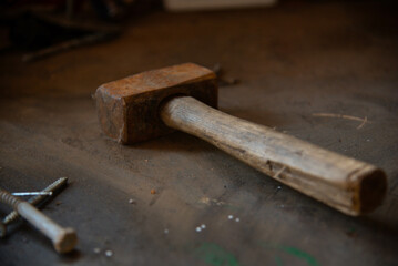 Old rusty hammer on simple background.