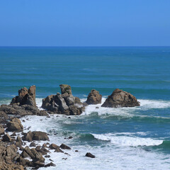 Rocks and Turquoise water in Punakaiki, New Zealand.