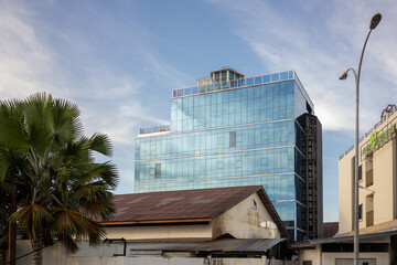Semporna Lighthouse Hotel (new glass walled accommodation) with Skyline Bar in corner.