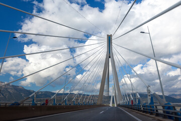 Obraz premium Driving along the Rio–Antirrio Bridge, one of the world's longest multi-span cable-stayed bridges and longest of the fully suspended type. In Greece, Europe.
