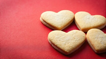 Heart shaped sugar cookies on red background Macro