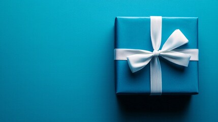 Charming blue gift box decorated with white ribbon on a bright turquoise blue surface, creating a cheerful atmosphere for Christmas or Valentine's Day celebrations or surprises.